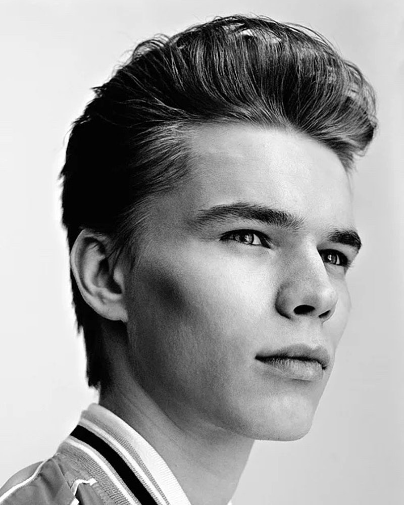 Black and white actor headshot of a young man turned slightly toward the camera.