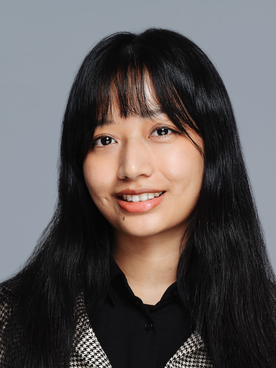 Polished business headshot of a woman in a black blazer for LinkedIn and professional use.